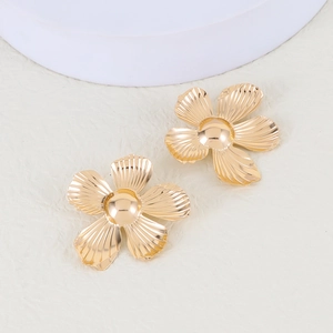 Vintage gold alloy flower earrings with textured petals and center gold bead accents