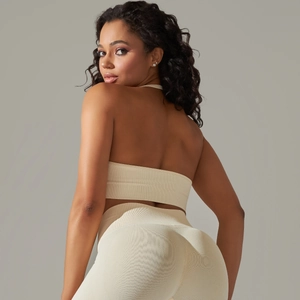 Seamless knitted yoga set with halter sports bra and high-waisted beige leggings