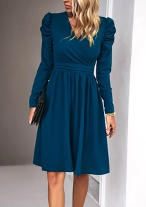 Detail of elegant V-neck dark blue dress with puff sleeves and high waist pleated design