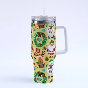 Detail of 40oz yellow Christmas tumbler with Santa, reindeer and snowman festive prints