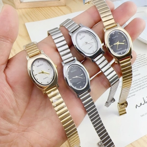Minimalist women's quartz watch with sleek elastic metal band in gold and silver