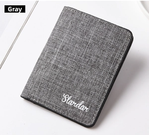 Macro view of grey minimalist canvas card holder showing woven texture and precise stitching
