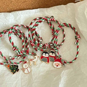 Christmas charm bracelets set with reindeer and santa pendants on woven cord