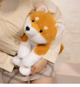 Soft Shiba Inu plush toy held by a model to show the large size and fluffy texture