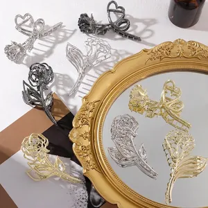 Elegant metal rose hair claws in gold, silver and black with sparkling rhinestone centers