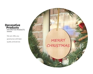 Close-up of circular wooden Christmas tag with red Merry Christmas text and twine