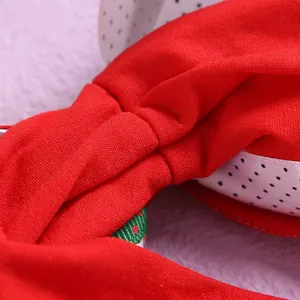 Red nylon baby headband with triple-layered polka dot ribbon bow and festive patterns