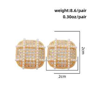 Detail of square gold earrings with pearls and zircons showing 2cm size and weight