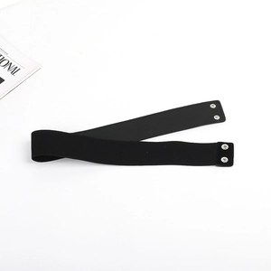 Close-up of black elastic waist belt featuring high-density fabric and silver snap buttons