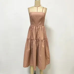 Dusty pink backless slip maxi dress with pleated waist and tiered skirt for beach vacation