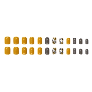 Short round vintage press-on nails with yellow, grey and floral patterns