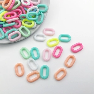 Close-up of colorful acrylic U-shaped chain links for DIY jewelry making and keychains
