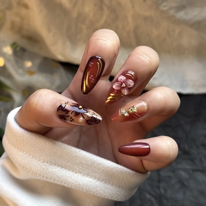 Brown 3D floral almond press-on nails with leopard print and golden foil details
