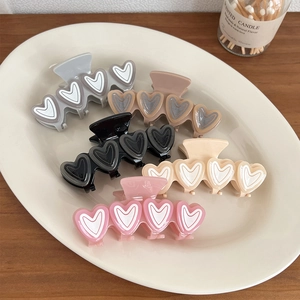 Set of five macaron color acetate heart hair claws in grey, brown, black, beige and pink