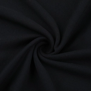Macro detail of soft black knit fabric showing elegant drape and smooth texture