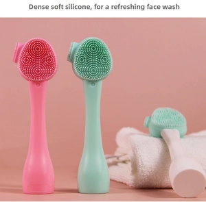 Close-up of double-sided silicone facial brush head with soft massage bristles
