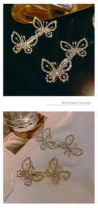 Detailed view of a sparkling gold butterfly hair clip encrusted with clear rhinestones