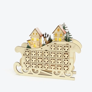 Wooden 24-day advent calendar in sleigh shape with LED lighting and festive miniatures