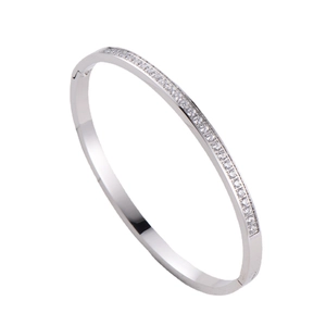 Sleek silver stainless steel bangle with CNC set rhinestones in a minimalist design