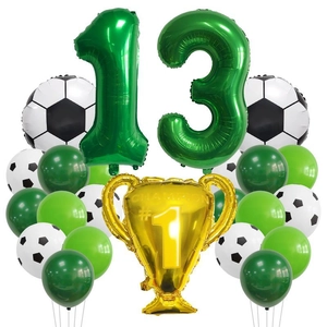 Soccer theme birthday decor with green number 13, golden trophy, and football balloons