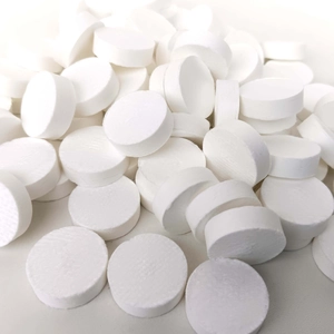 Portable disposable compressed cotton towels in white round tablets for travel and beauty