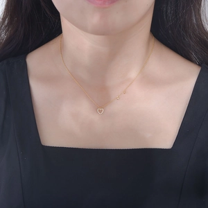 S925 sterling silver heart necklace in gold with diamonds worn by model for elegant look