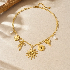 Gold stainless steel evil eye necklace with sun, heart, and pearl pendants on O-chain