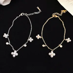 Elegant gold and silver flower pearl bracelets with clover charms and zircon accents