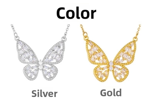 Detail view of butterfly necklaces in silver and gold finishes with zircon accents