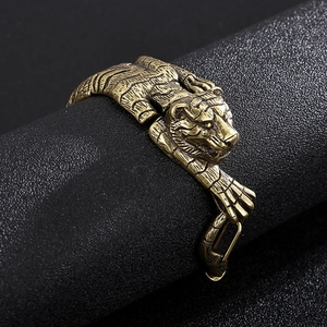 Retro tiger head bracelet in antique gold finish with detailed embossed textures