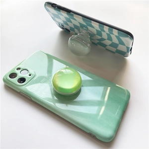 Glossy checkered and mint green phone case with clear crystal ball expanding socket
