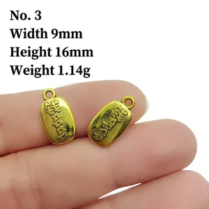 Macro view of 9x16mm vintage gold peanut pendant showing size and purse relief detail