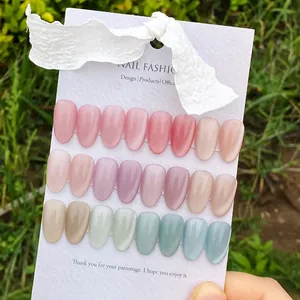 Outdoor natural light view of 24pcs cat eye press-on nails with shimmering glass bead effect