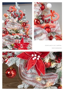 Macro detail of red and white candy ornaments and mesh ribbons on a snowy Christmas tree