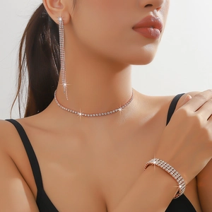 Sparkling rhinestone jewelry set with tassel earrings, necklace, and rose gold bracelet