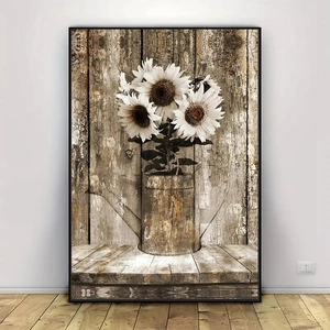 Vintage canvas wall art of white sunflowers in a rusty watering can with a black frame