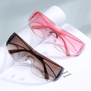 Occhiali da sole Y2K senza montatura con strass in rosa e marrone sfumato