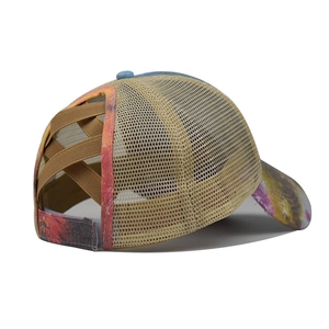 Detail of colorful tie-dye baseball cap with criss-cross elastic bands for ponytails