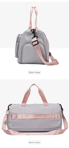 Detail of travel bag showing side zipper pocket and luggage sleeve for suitcase attachment