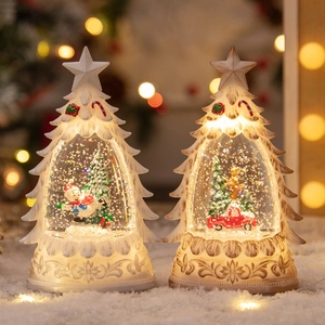 Illuminated Christmas tree snow globe with snowman and red truck on snowy base