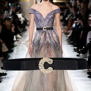 Elastic black waist belt for dresses with a large sparkling rhinestone C-letter buckle