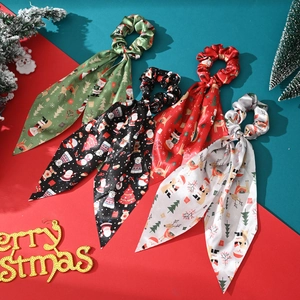 Set of four Christmas satin hair scrunchies with ribbons in green, red, black, and white