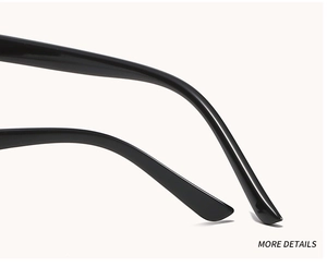 Macro shot of glossy black temple tips with smooth curves on stylish cat-eye sunglasses