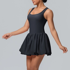 Detail of black tennis dress featuring a high-stretch bodice and pleated bubble hem skirt