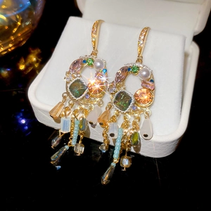 Detailed close-up of luxury vintage tassel earrings with colorful crystals and pearls