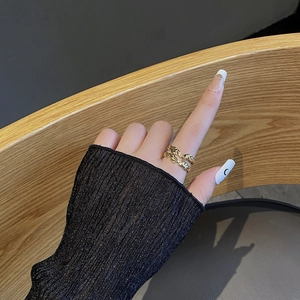 Detail showing the golden wave texture of the irregular minimalist silver ring for women