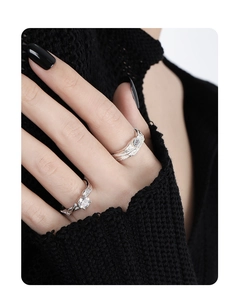 Detailed close-up of S925 silver rings with irregular texture and sparkling round cut diamond