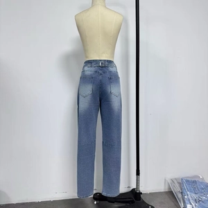 Detail view of the back pocket layout and straight leg cut of light blue washed jeans