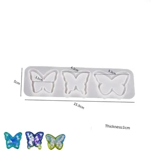 Détail du moule en résine papillon avec mesures de 15,9 cm de long et 1 cm d'épaisseur