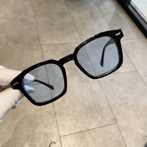Retro square oversized sunglasses with black frames, blue lenses and silver stud detail